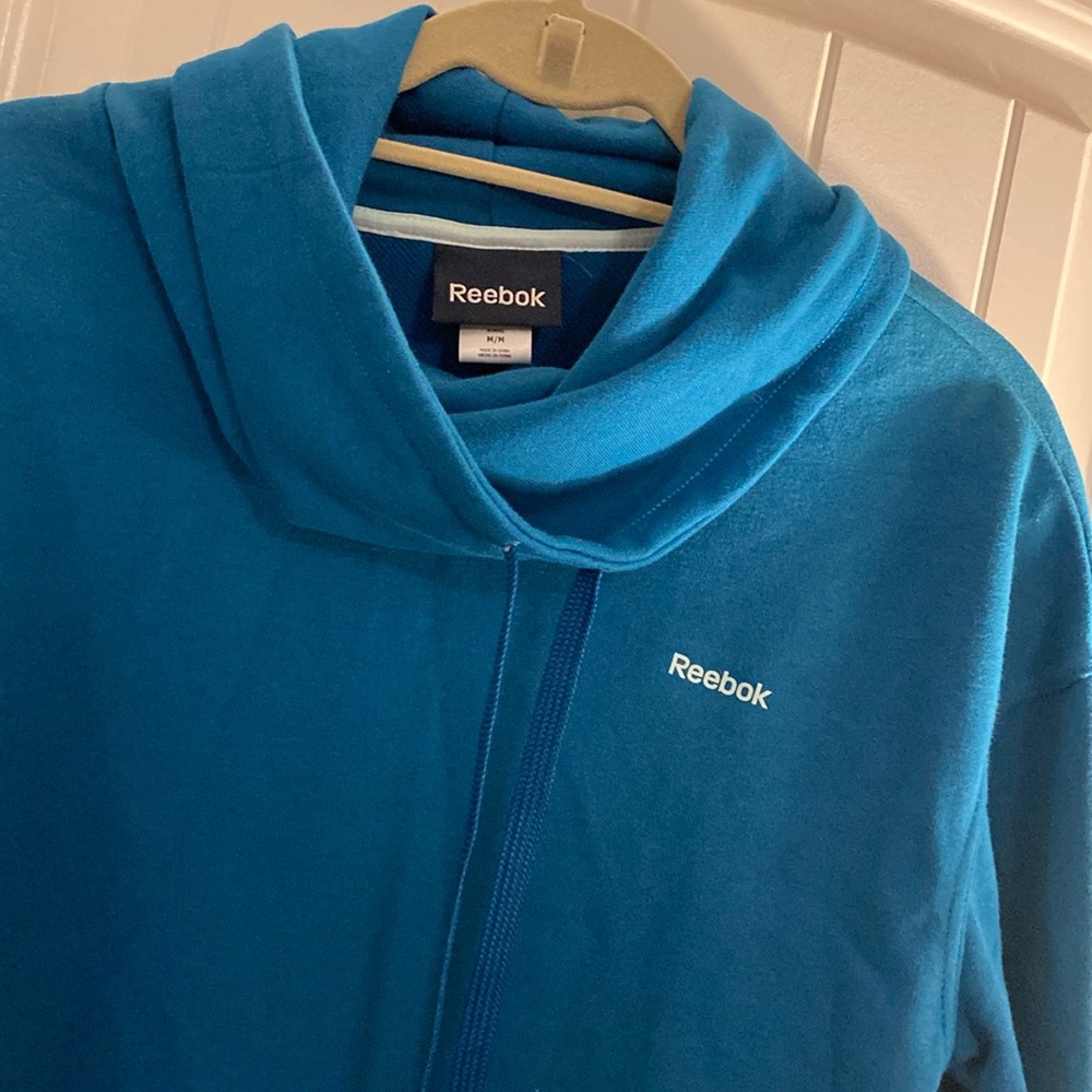 Reebok cowl neck light weight sweatshirt. The color is a beautiful teal. Size M
